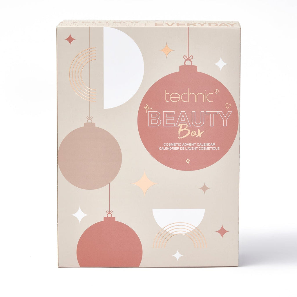 The beauty box advent calendar on a white background. The box is beige with pink coloured cartoon baubles on the front.