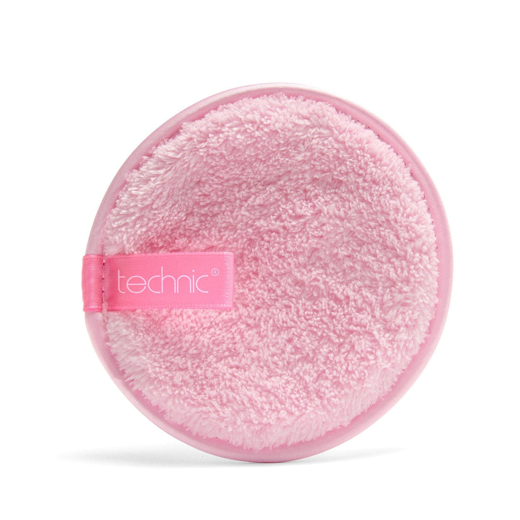 Pink round makeup pad with 'technic' branding on a white background