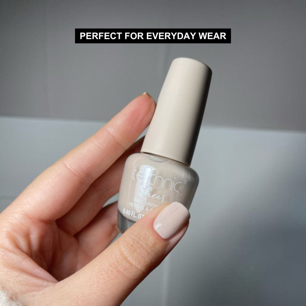 Models hand holding sheer nail varnish bottle in the shade beige. Text above saying "Perfect For Everyday Wear"