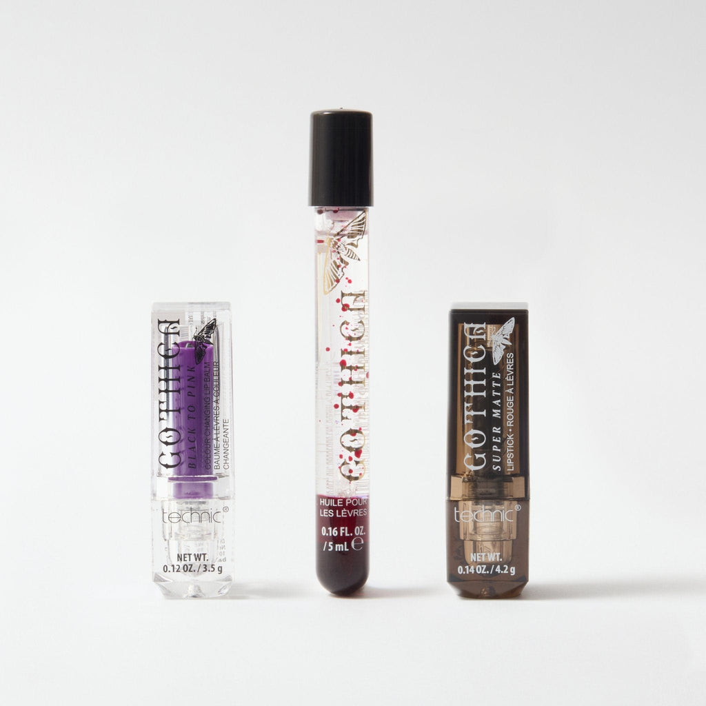A gothica colour changing lip blam, bloodmoon lip oil and a black lipsticks all next to each other on a white background.