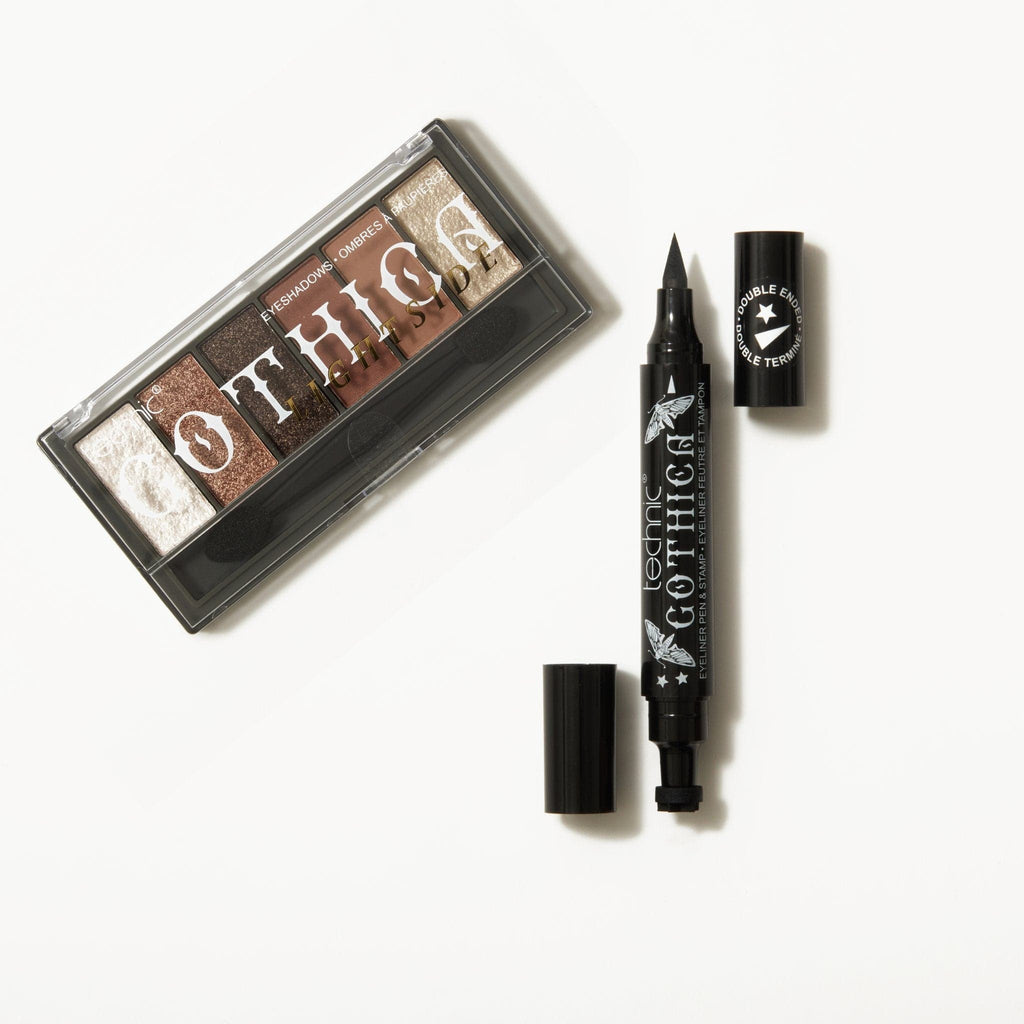 A gothica eyeshadow palette and an opened gothica eyeliner next to each other on a white background.